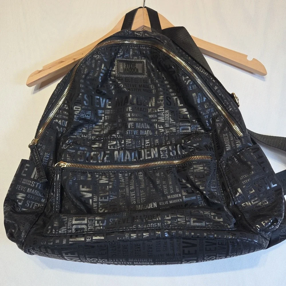 Steve Madden Black Logo Print Backpack Gold Tone Zippers Large Book Travel Bag